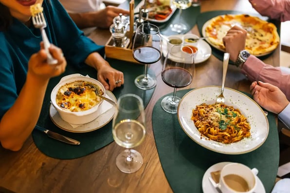 People at a restaurant - Image by adriaticfoto / Shutterstock.com